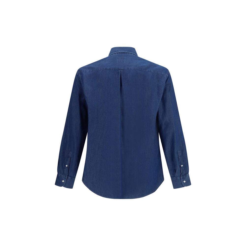 Discover the Brunello Cucinelli Blue Denim Shirt, a masterpiece of 100% cotton, blending timeless elegance with versatile luxury for the discerning individual.