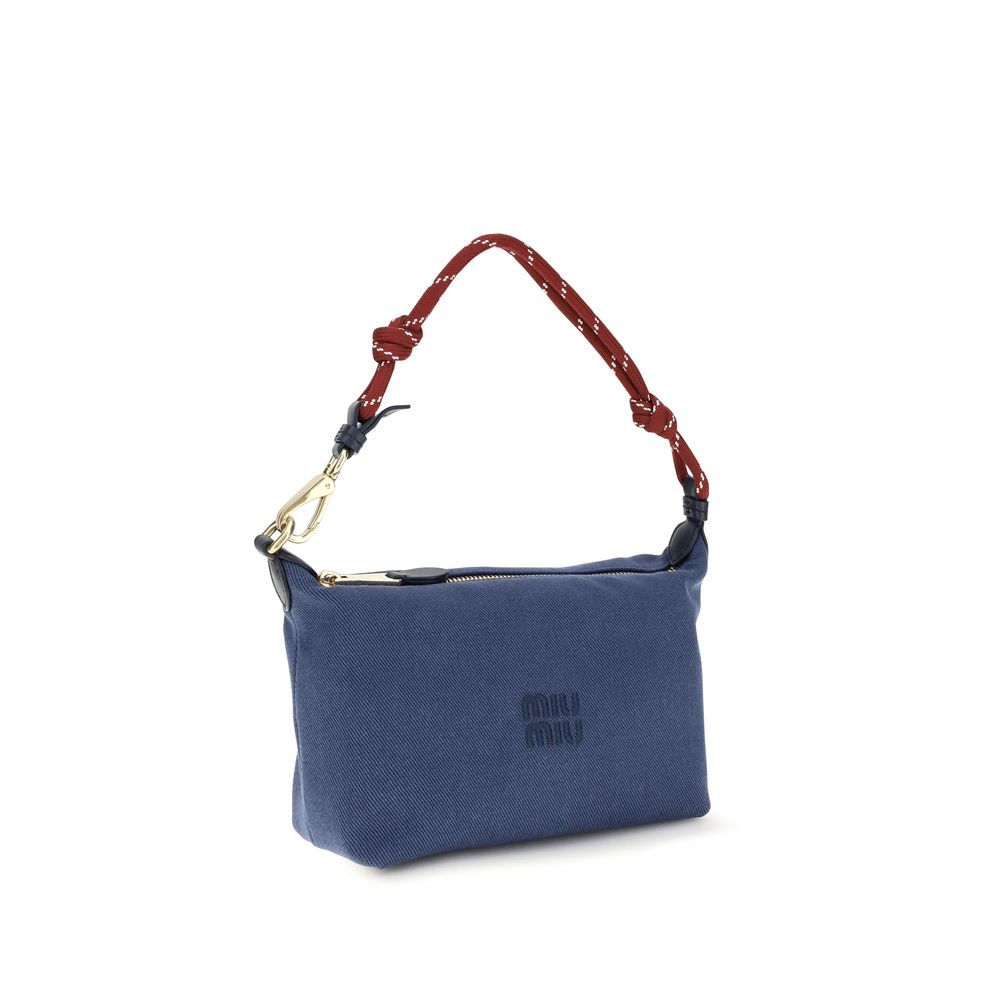 Discover the Miu Miu Blue Cotton Shoulder Bag, a masterpiece of elegance and functionality, perfect for those who appreciate luxurious craftsmanship and timeless style.