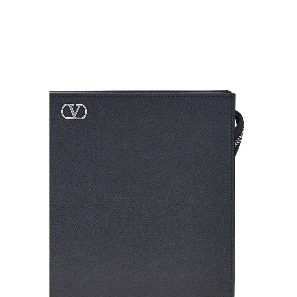 Indulge in the elegance of the Valentino Garavani Black Calf Leather Bos Taurus Wallet, a masterpiece of minimalist design and luxurious craftsmanship, perfect for the discerning individual.