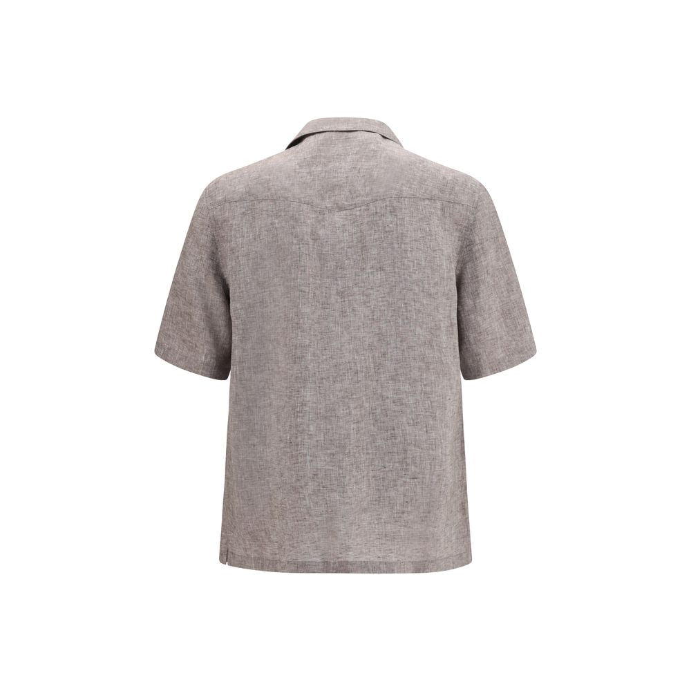 Discover the Brunello Cucinelli Gray Linen Shortsleeve Shirt, a masterpiece of breathable linen, perfect for effortless elegance in warm weather.