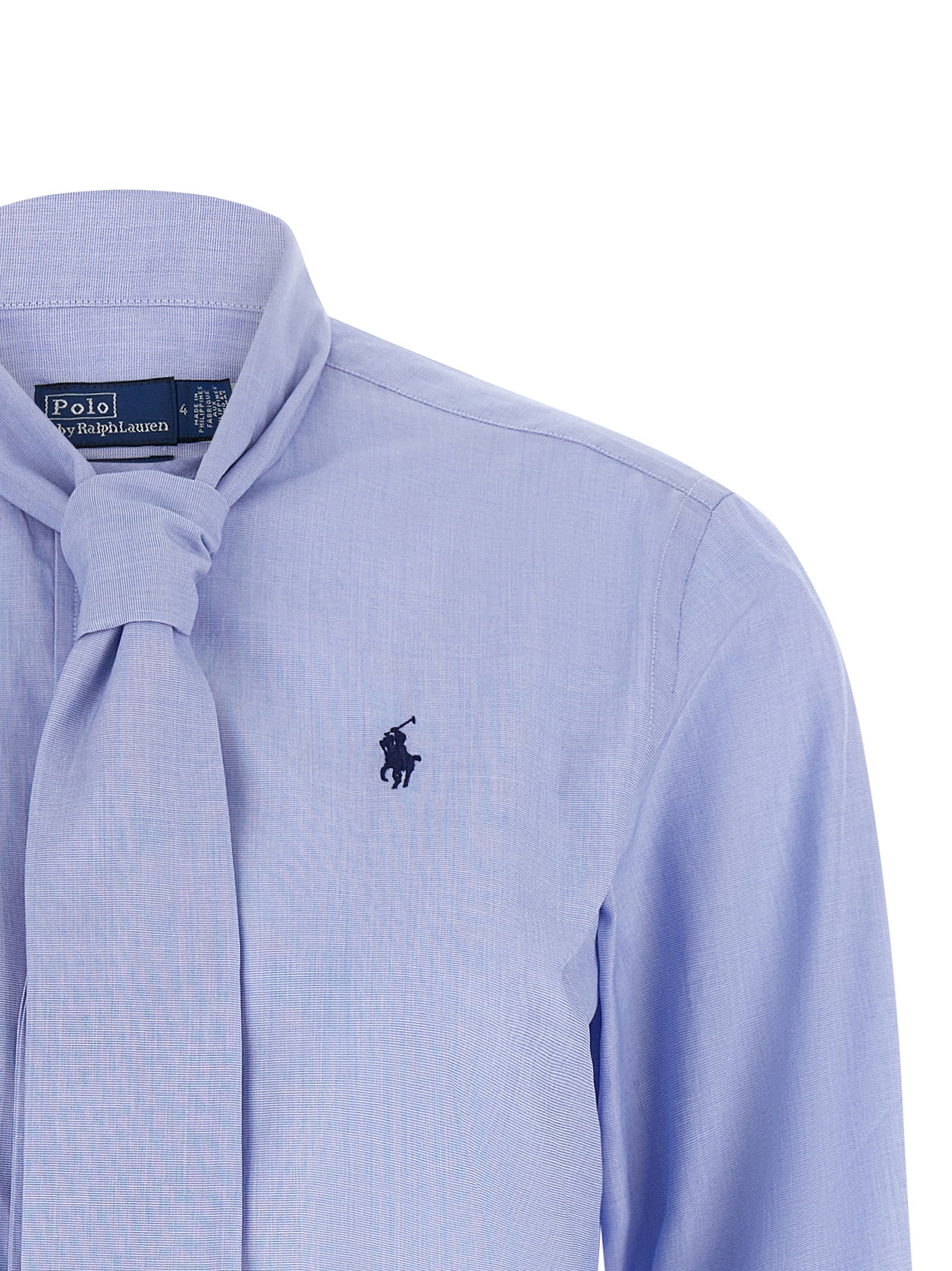 Discover the elegance of the Polo Ralph Lauren Blue Cotton Blouse, a refined masterpiece crafted from pure cotton, embodying timeless sophistication and modern allure.