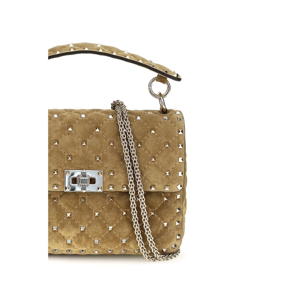 Indulge in the elegance of the Valentino Garavani Beige Calf Leather Bos Taurus Shoulder Bag, a luxurious statement piece crafted in Italy, perfect for any sophisticated occasion.