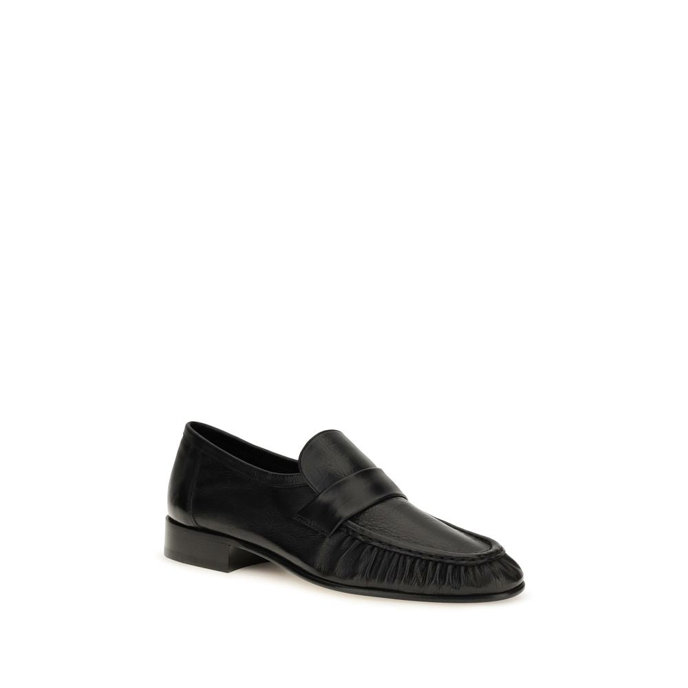The Row Black Calf Leather Bos Taurus Slip-On Loafers - Luxury Redefined