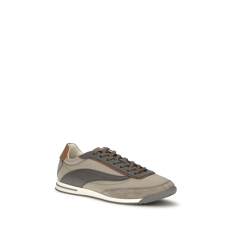 Indulge in the exquisite Brunello Cucinelli Beige Suede Leather Low Top Sneakers, where luxurious craftsmanship meets timeless elegance for the discerning individual.
