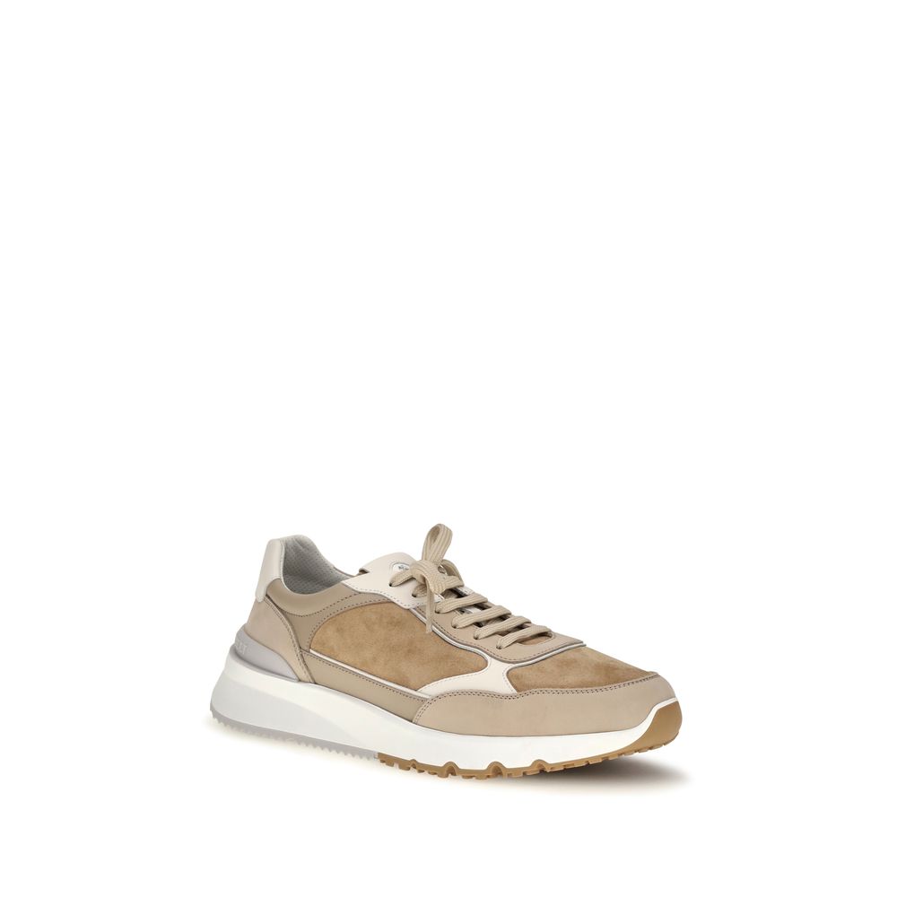 Elevate your style with Brunello Cucinelli's Beige Calf Leather Bos Taurus Low Top Sneakers, where Italian craftsmanship meets luxurious comfort for the discerning individual.