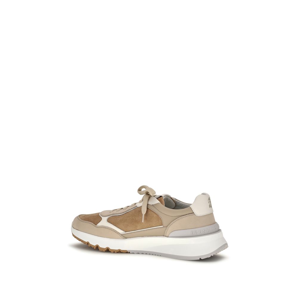 Step into a realm of elegance with Brunello Cucinelli's Beige Calf Leather Bos Taurus Low Top Sneakers, where Italian craftsmanship meets luxurious comfort for the discerning individual.