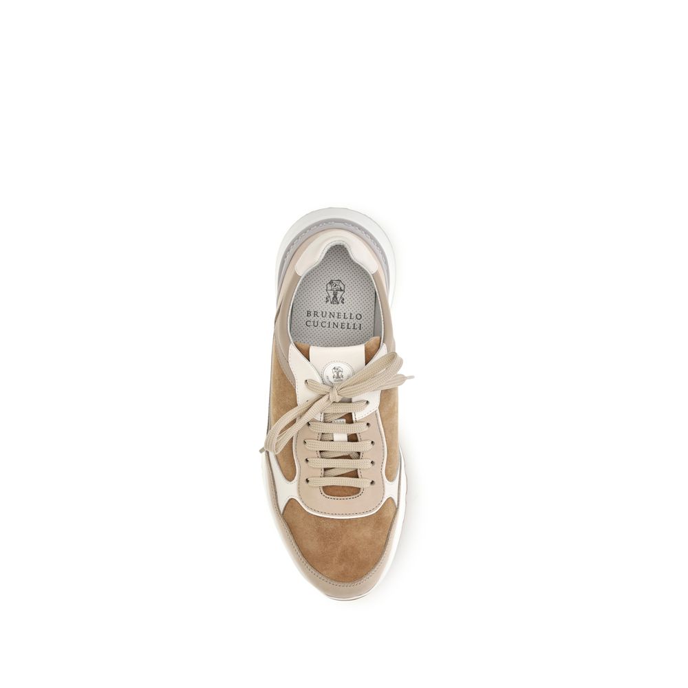 Experience the epitome of luxury with Brunello Cucinelli's Beige Calf Leather Bos Taurus Low Top Sneakers, where Italian craftsmanship meets timeless elegance for the discerning individual.