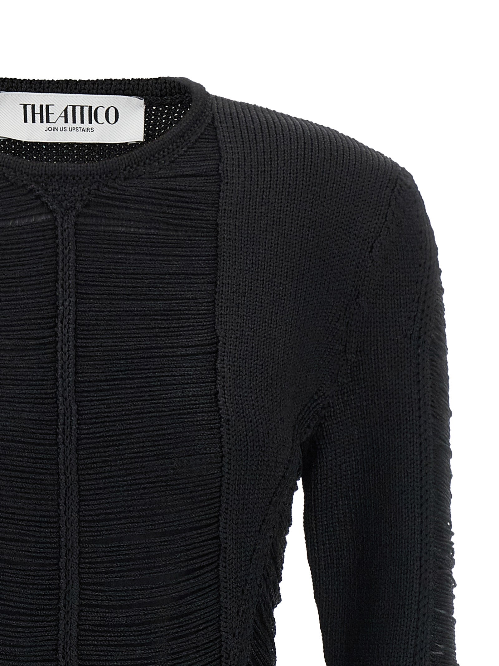 Indulge in the allure of THE ATTICO Black Viscose Short Dress, a masterpiece of Italian craftsmanship that redefines elegance with its semi-transparent design and fringe details.