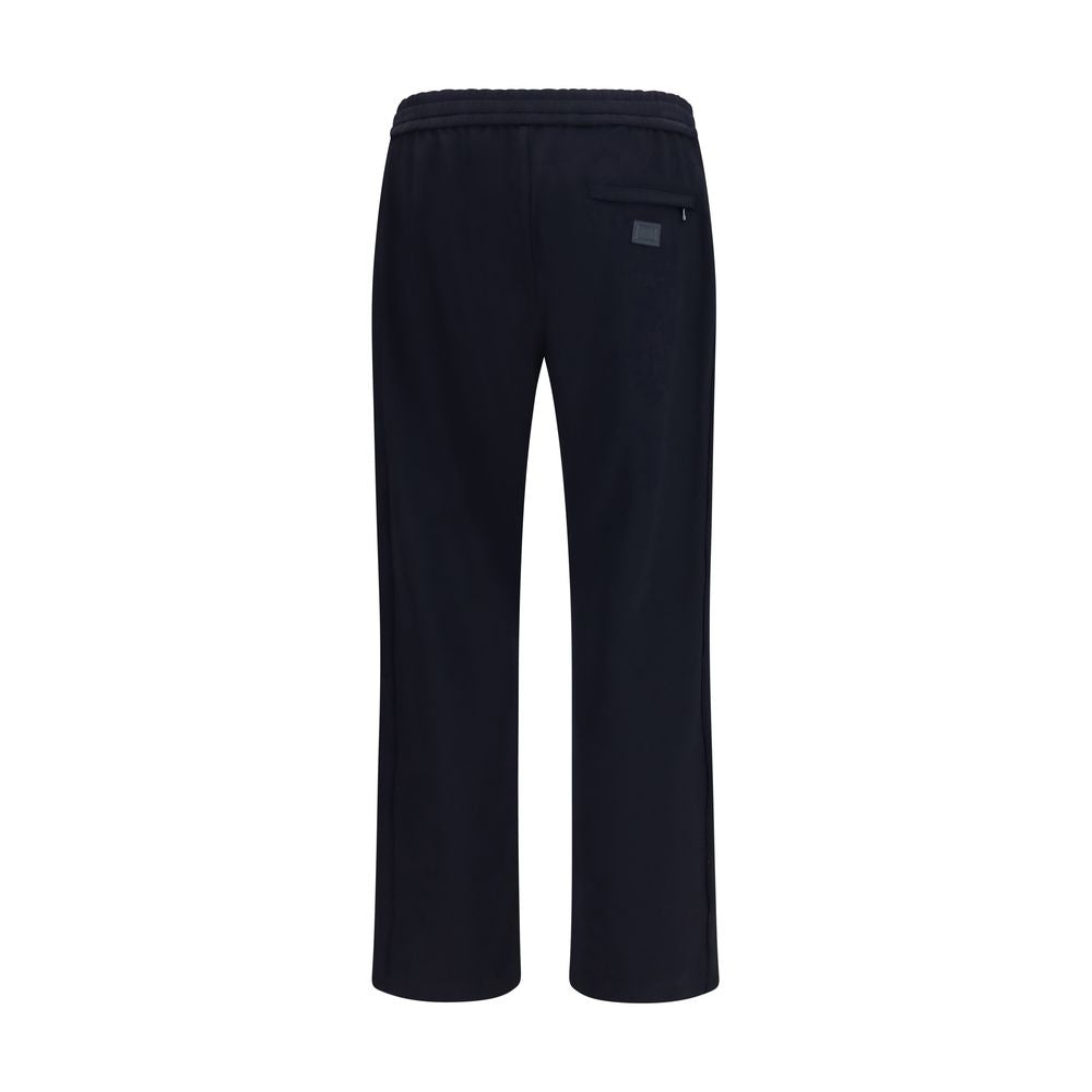 Experience the exquisite Dolce & Gabbana Blue Polyamide Athletic Pants, a blend of luxury and functionality, crafted for the discerning individual who values sophistication and style.