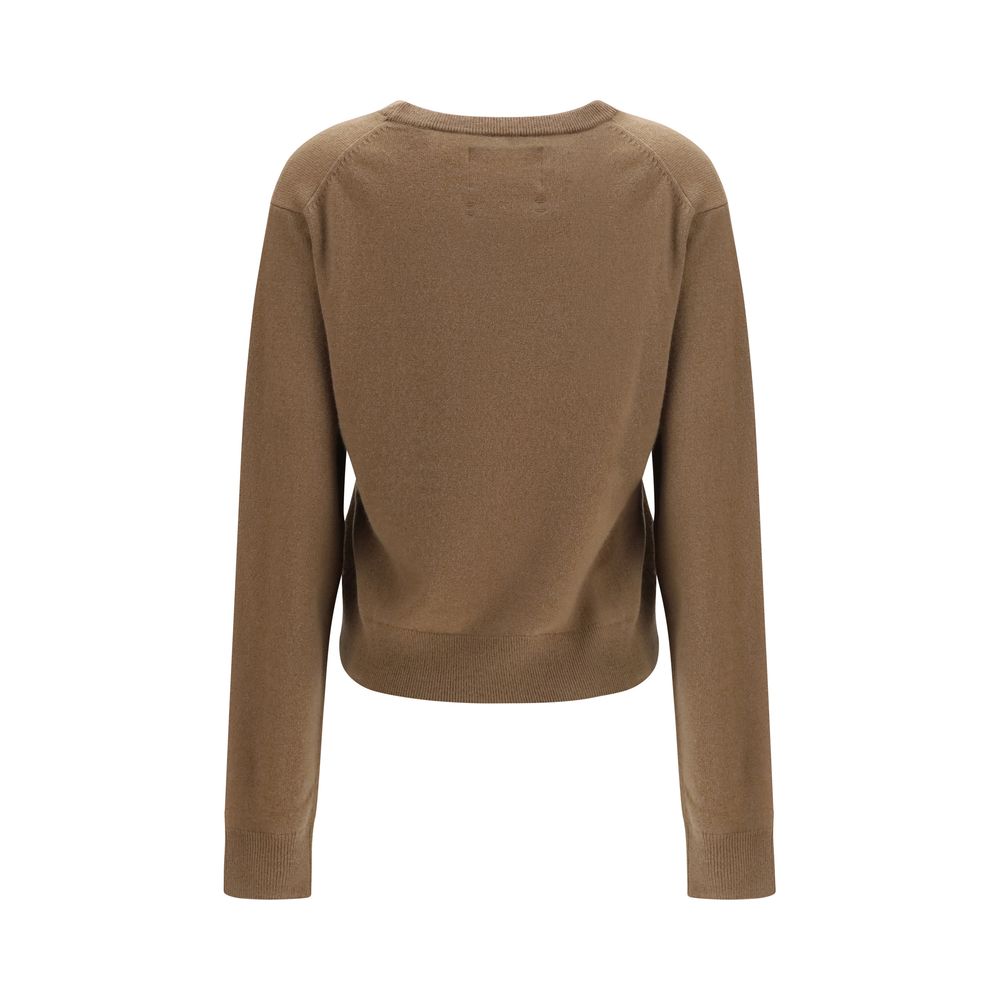 Indulge in the N°475 March cashmere Sweater by Extreme Cashmere, crafted from pure grey melange cashmere, embodying effortless elegance and timeless luxury.