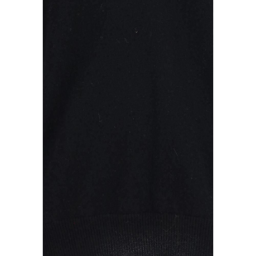 Indulge in the ultimate luxury with the Extreme Cashmere Black Cashmere Sweater, a timeless piece crafted from pure cashmere, perfect for elevating your wardrobe.