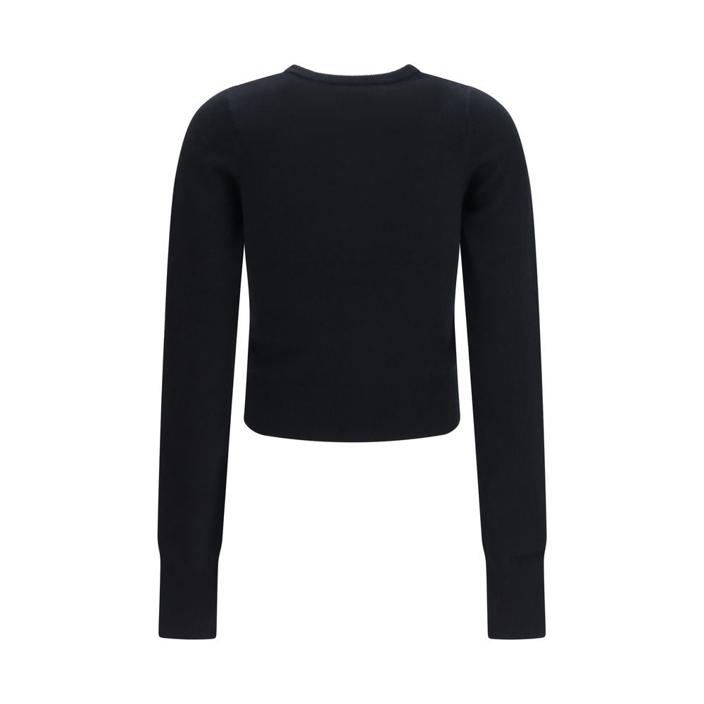 Indulge in the exquisite allure of the Extreme Cashmere Black Cashmere Cardigan, a timeless piece crafted from luxurious cashmere for refined elegance in every moment.