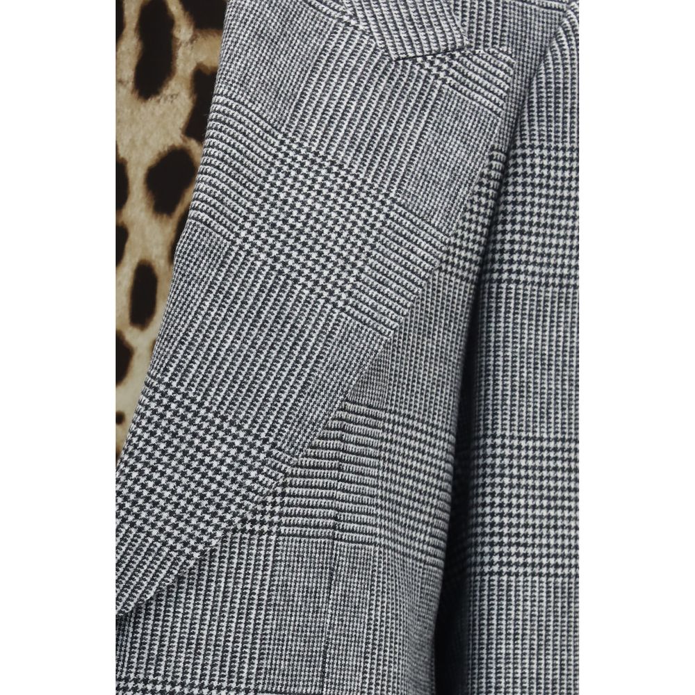 Elevate your wardrobe with the Dolce & Gabbana Gray Wool Oves Aries Blazer, a masterpiece of tailored elegance, crafted from luxurious fleece wool for a sophisticated silhouette.