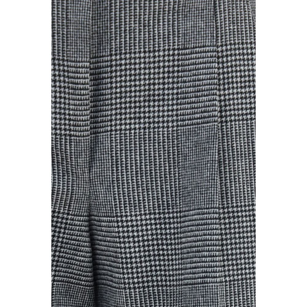 Elevate your wardrobe with the Dolce & Gabbana Gray Wool Oves Aries Dress Pants, a masterpiece of luxury tailoring that embodies sophistication and timeless elegance.
