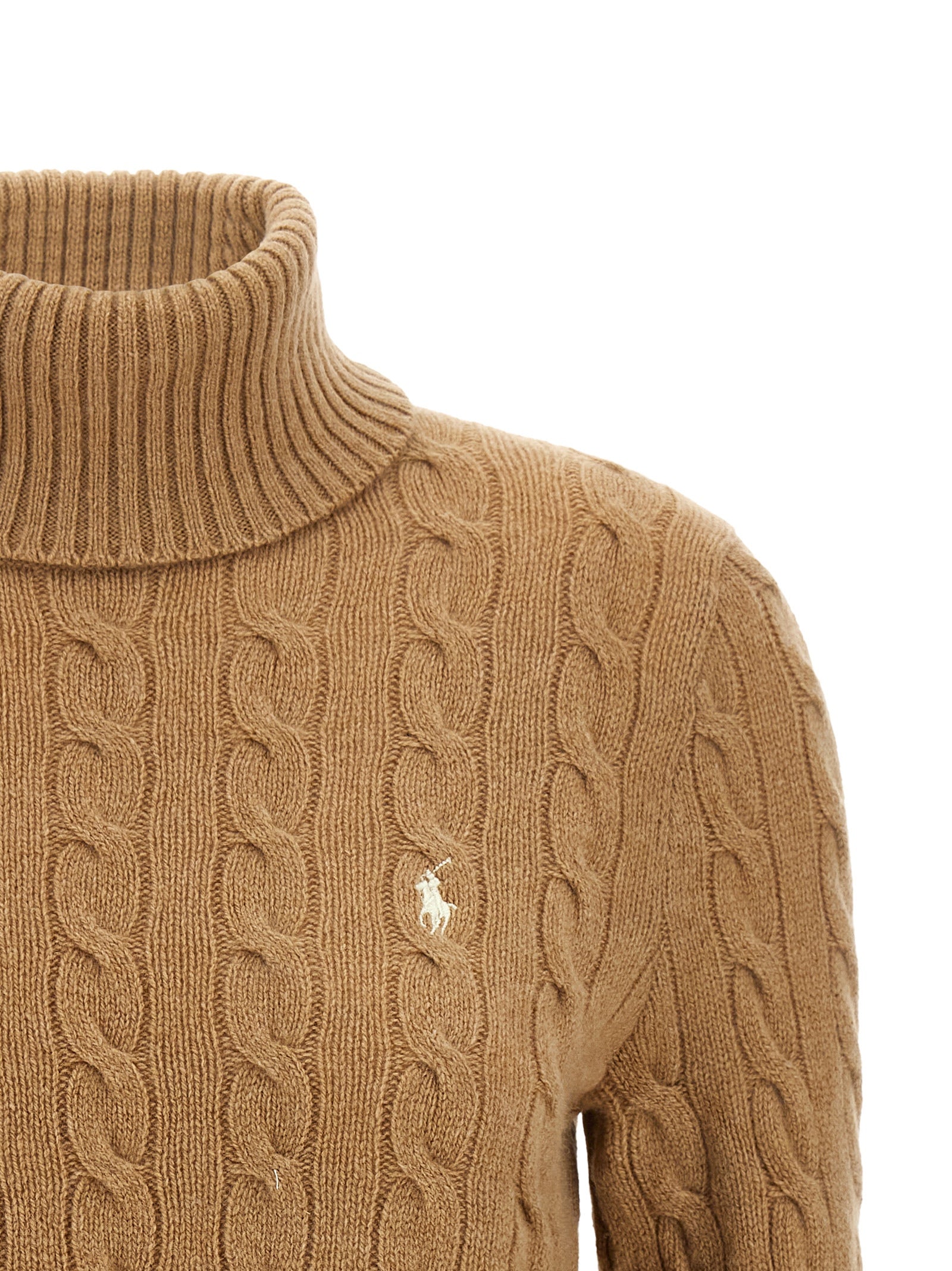 Experience the exquisite craftsmanship of the Polo Ralph Lauren Beige Wool Cardigan, a timeless blend of wool and cashmere that elevates your style with luxurious sophistication.