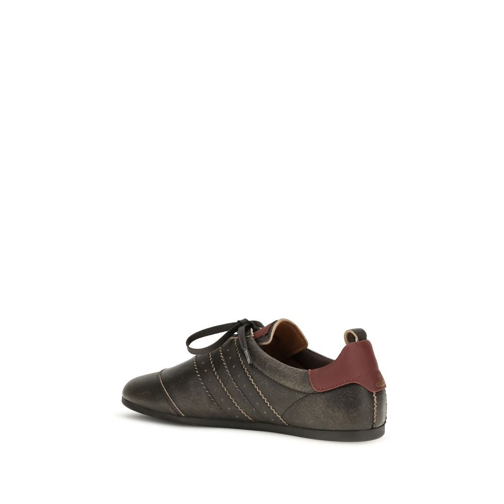 Elevate your style with Vivienne Westwood's Black Calf Leather Bos Taurus Sneakers, where distressed leather meets iconic design, embodying luxury and timeless sophistication.