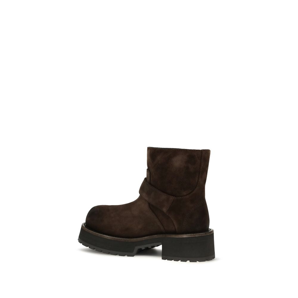 Indulge in the exquisite craftsmanship of Balenciaga's Brown Calf Leather Bos Taurus Ankle Boots, where contemporary design meets luxurious comfort for the discerning individual.