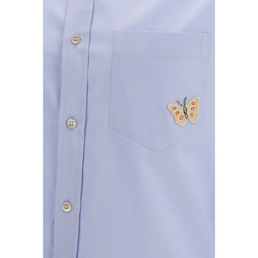 Indulge in the exquisite Valentino Garavani Blue Cotton Dress Shirt, a masterpiece of soft cotton and butterfly embroidery, embodying timeless elegance and effortless sophistication.