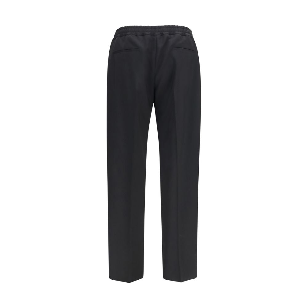 Elevate your wardrobe with Valentino Garavani's Black Cotton Chino Pants, a refined blend of classic style and modern elegance, crafted for the discerning individual.