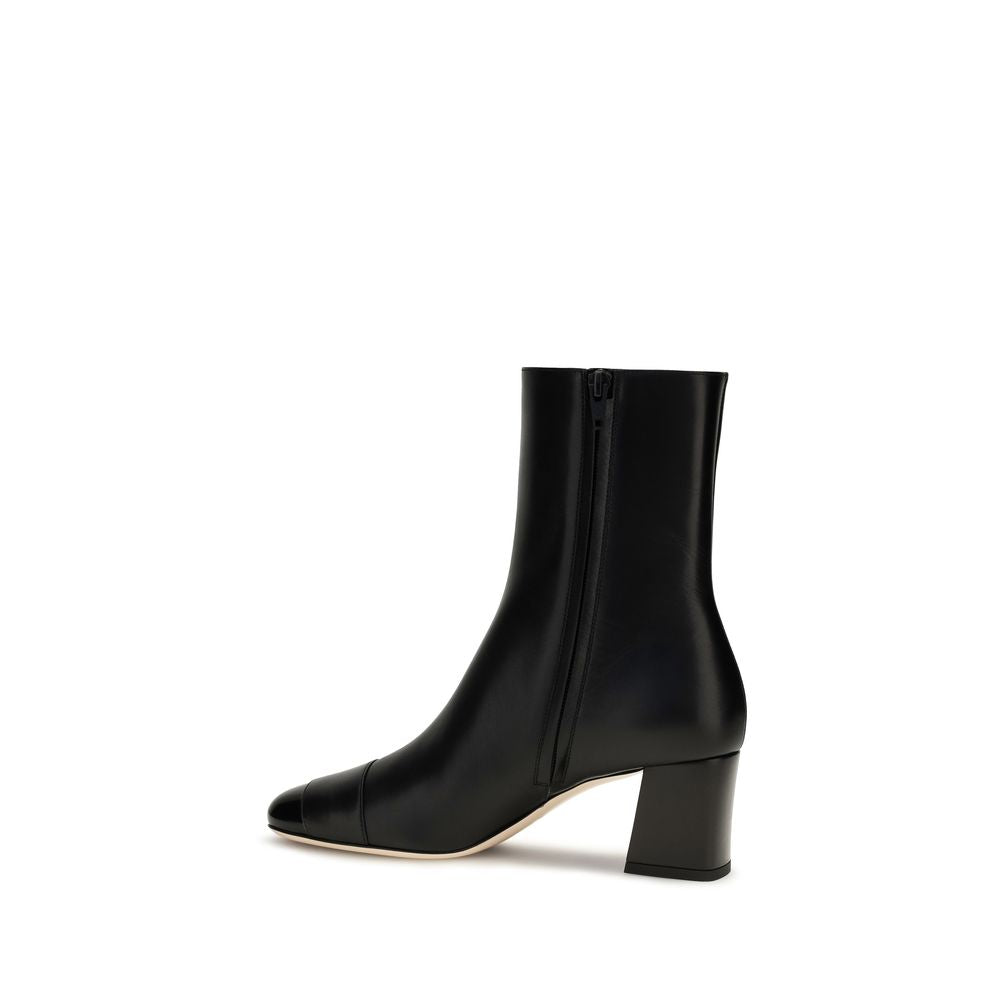 Indulge in the elegance of Valentino Garavani's Black Calf Leather Bos Taurus Ankle Boots, where exquisite craftsmanship meets timeless luxury for the discerning individual.