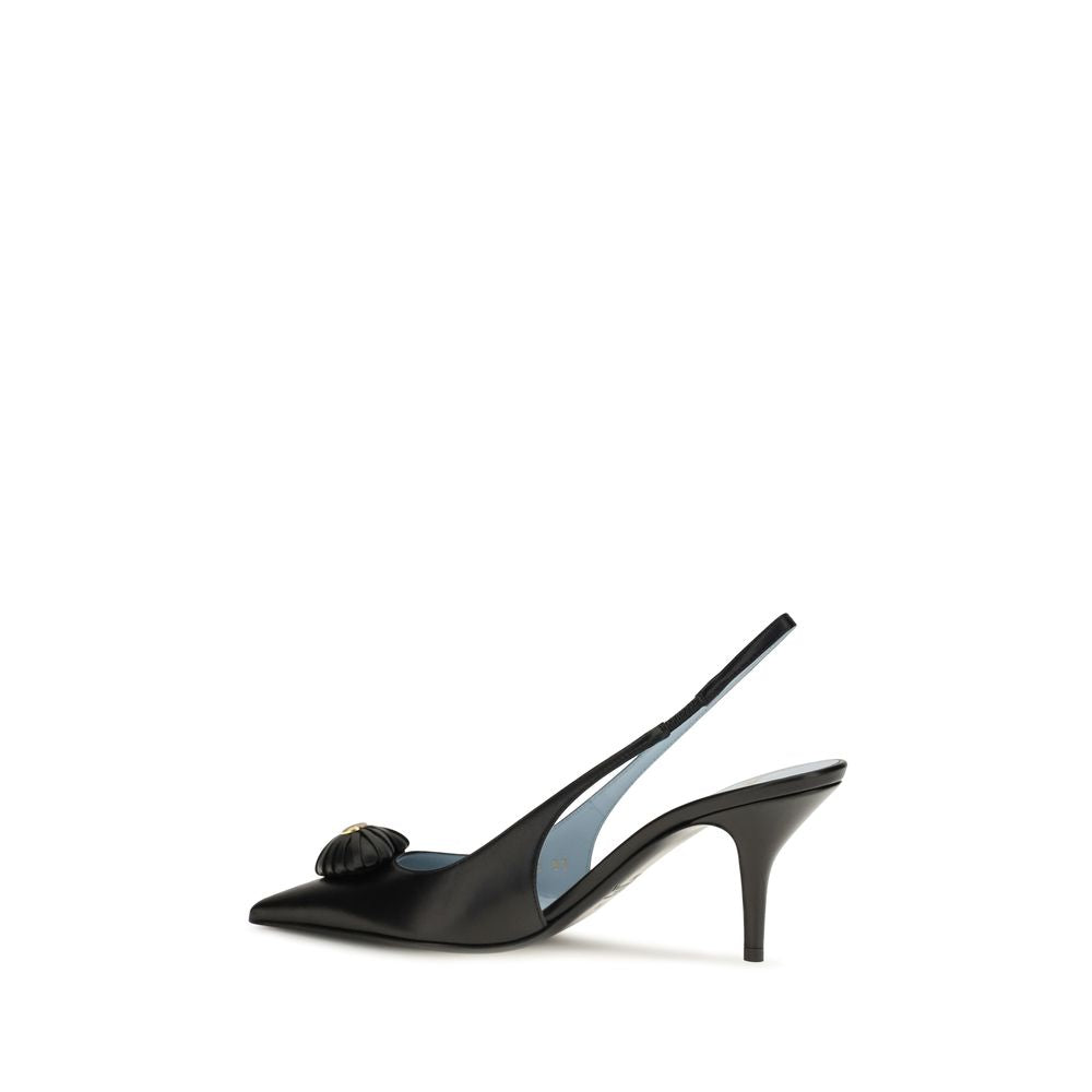 Indulge in the exquisite elegance of Valentino Garavani's Black Calf Leather Bos Taurus High Heel Pumps, where romantic charm meets luxurious craftsmanship for the discerning connoisseur.