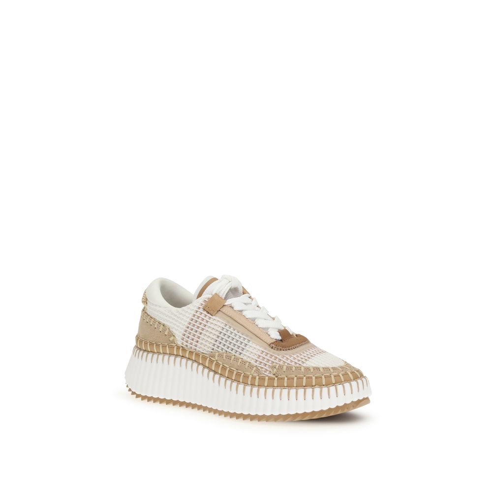 Elevate your style with Chloé's Nama Sneakers, crafted from recycled materials for a luxurious blend of sustainability and contemporary design, perfect for the discerning individual.