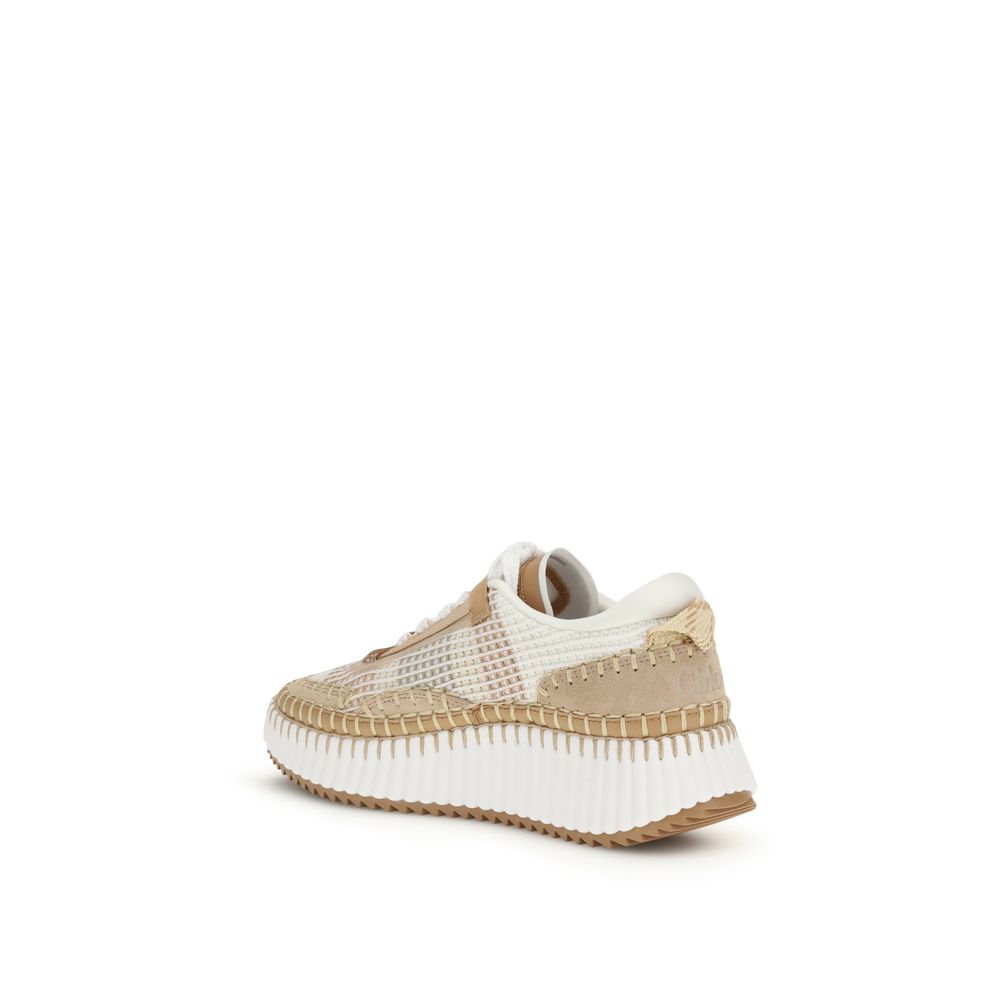 Discover the Chloé Beige Nylon Athletic Sneakers, where contemporary design meets sustainable luxury, crafted from recycled materials for a stylish, eco-conscious stride.