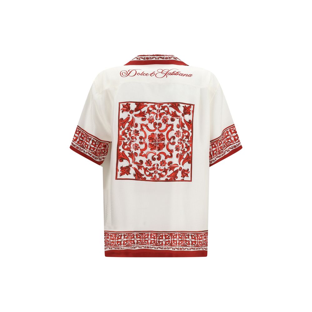 Indulge in the exquisite Dolce & Gabbana White Silk Pattern Shirt, a masterpiece of Italian craftsmanship adorned with a captivating Majolica print, perfect for the discerning connoisseur.