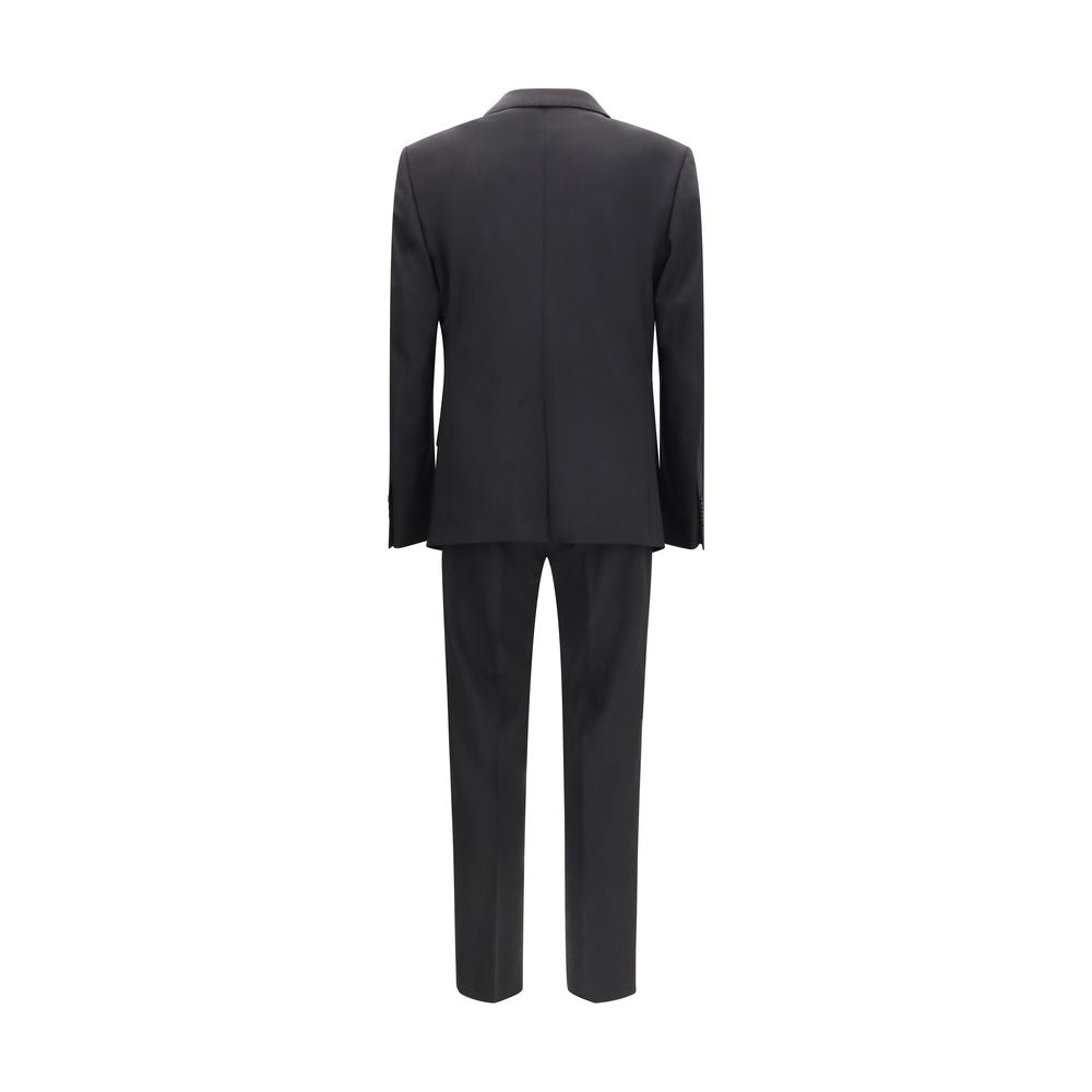 Elevate your wardrobe with the Dolce & Gabbana Black Wool Oves Aries Two-Piece Suit, a masterpiece of Italian craftsmanship, blending luxurious wool with timeless elegance.
