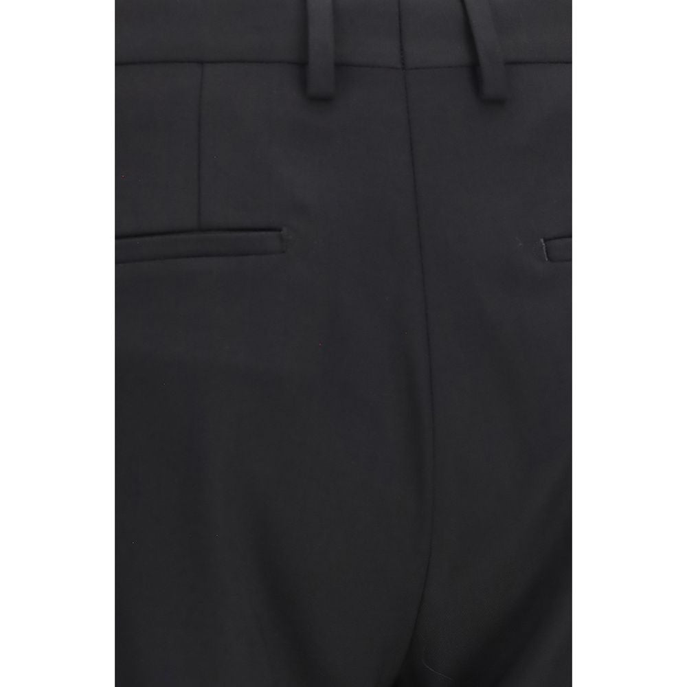 Experience the exquisite craftsmanship of the Dolce & Gabbana Black Wool Oves Aries Two-Piece Suit, a timeless blend of luxury and contemporary elegance, perfect for the discerning individual.