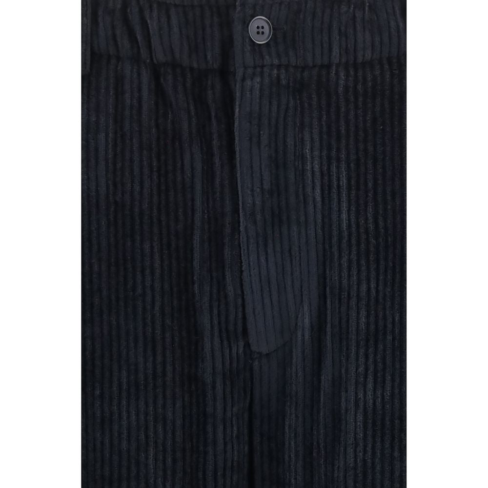 Indulge in the elegance of Giorgio Armani's Black Viscose Casual Pants, where luxurious ribbed velvet meets impeccable Italian craftsmanship for a sophisticated silhouette.