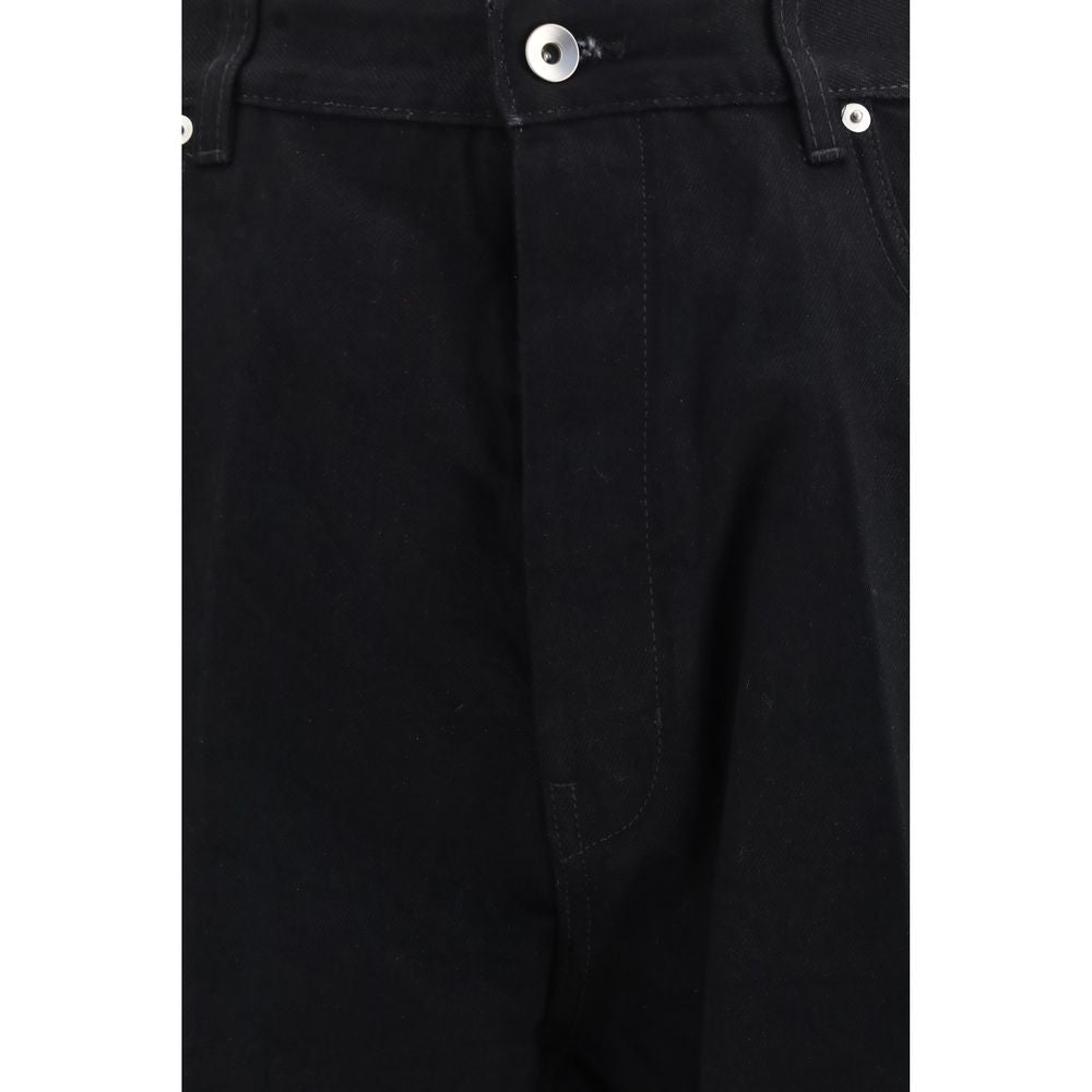 Elevate your wardrobe with Rick Owens Black Cotton Flared Jeans, a bold reinterpretation of denim that embodies contemporary luxury and effortless style.