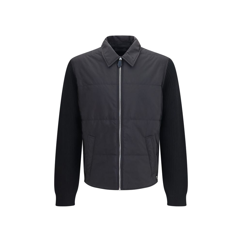 Experience the exquisite blend of technical innovation and refined craftsmanship with the Prada Black Wool Oves Aries Full-Length Jacket, a statement piece for the discerning individual.
