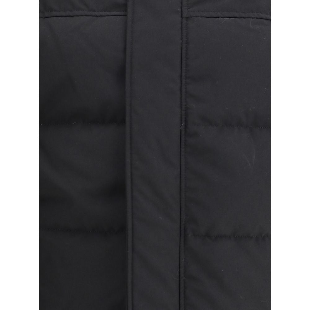 Experience the epitome of luxury with the Canada Goose Black Cotton Parka, an exquisite blend of style and warmth, perfect for those who command elegance in every season.