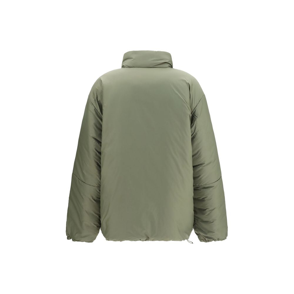Indulge in the Miu Miu Bicolor Goose Down Shell Jacket, a luxurious blend of sustainable materials and elegant design, perfect for those who embrace sophistication and warmth.