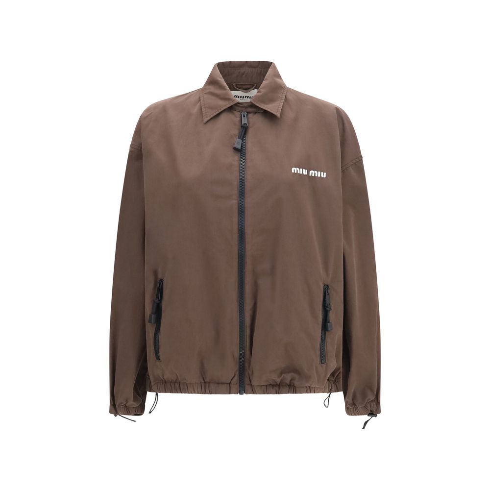 Indulge in the Miu Miu Brown Cotton Full-Length Jacket, a masterpiece of unlined elegance and oversized sophistication, perfect for the discerning fashion connoisseur.