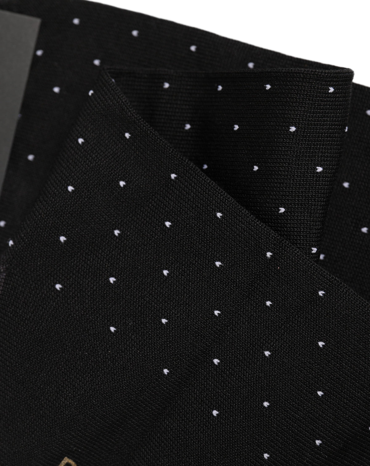 Elevate your style with Dolce & Gabbana's Black Cotton Polka Dot Socks, a luxurious blend of comfort and sophistication, crafted in Italy for the discerning individual.