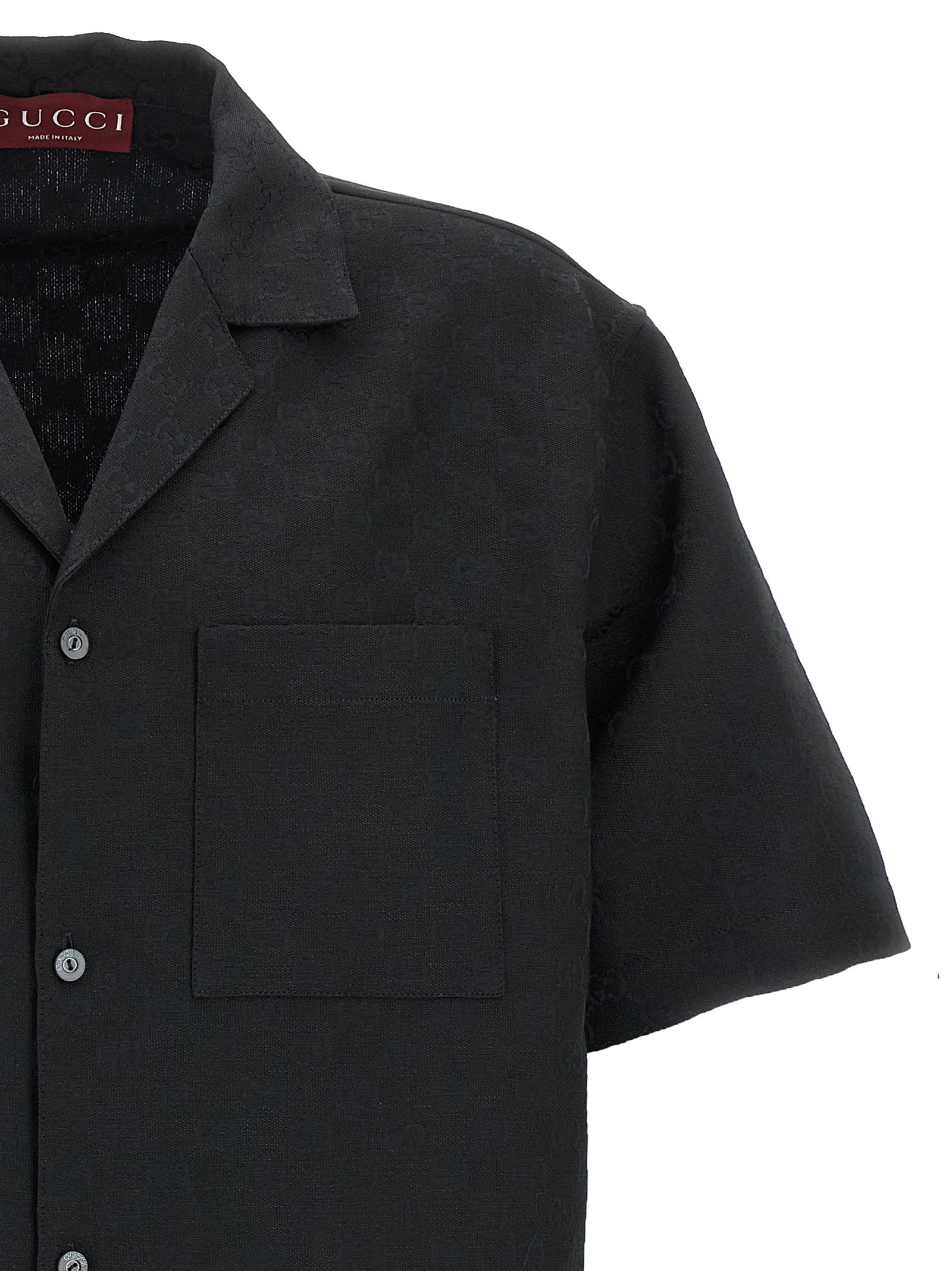 Elevate your wardrobe with the Gucci Black Linen Blouse, a masterpiece of Italian craftsmanship featuring a chic V-neck and luxurious side slits for effortless sophistication.
