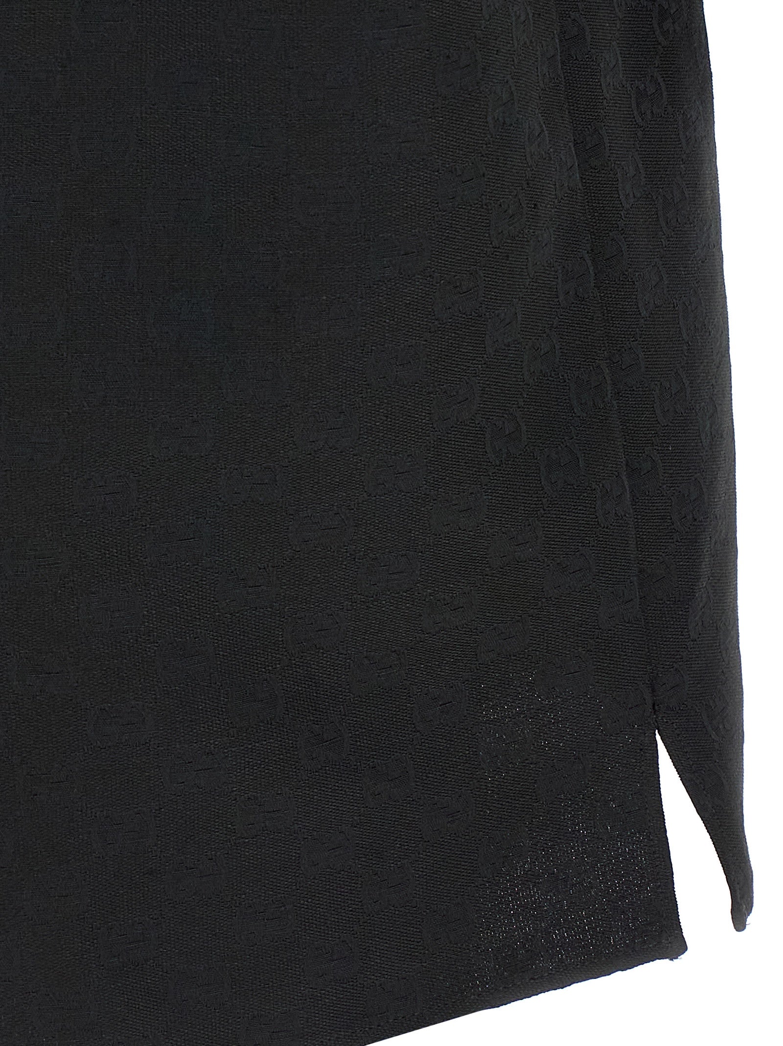Indulge in the exquisite craftsmanship of the Gucci Black Linen Blouse, a luxurious staple that embodies elegance and sophistication for the discerning fashion connoisseur.