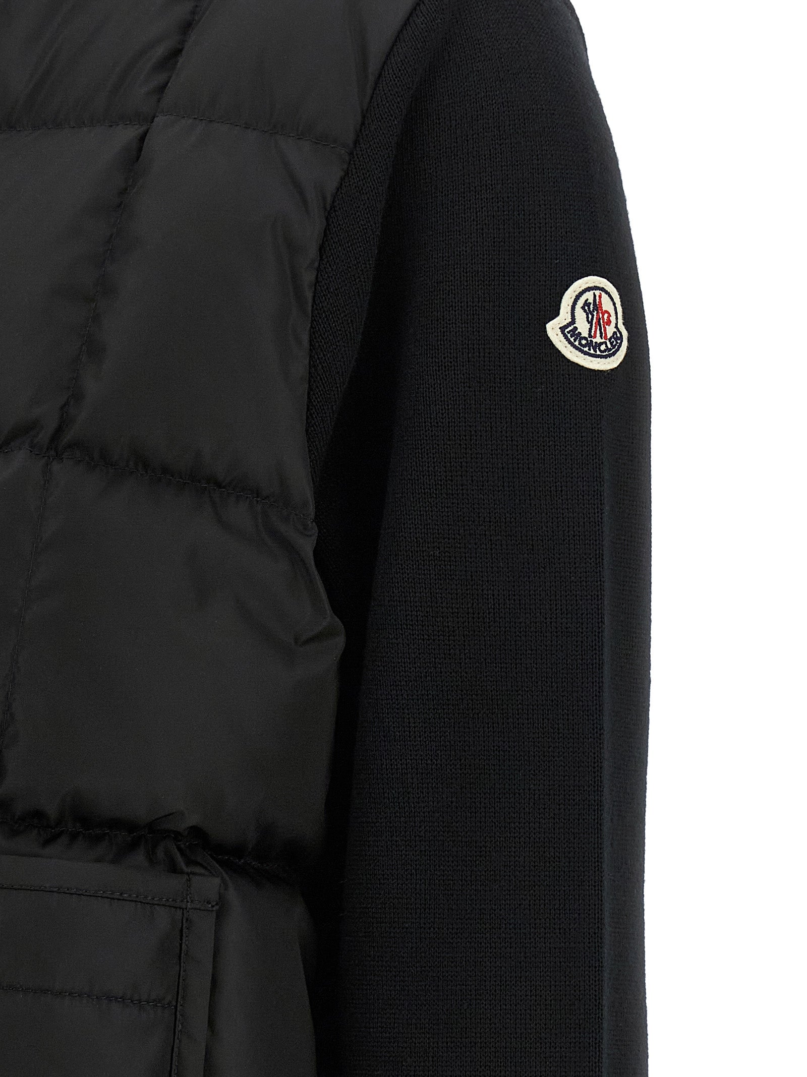 Indulge in the Moncler Black Virgin Wool Cardigan, a masterpiece of hybrid design and luxurious warmth, perfect for those who appreciate timeless elegance and modern sophistication.