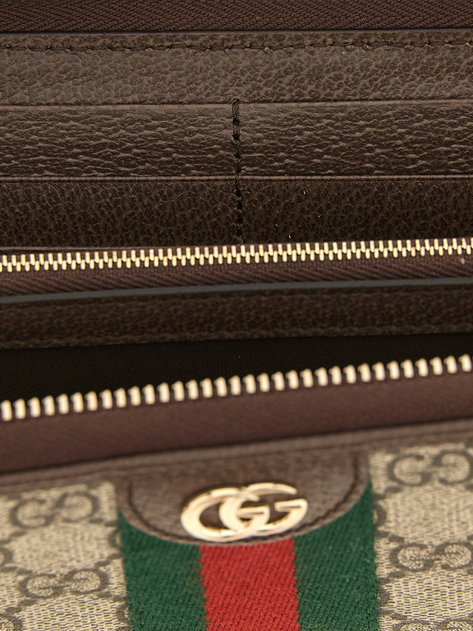 Discover the Gucci Brown Polyethylene Cardholder, a blend of exquisite craftsmanship and iconic design, elevating your style with luxurious materials and timeless elegance.