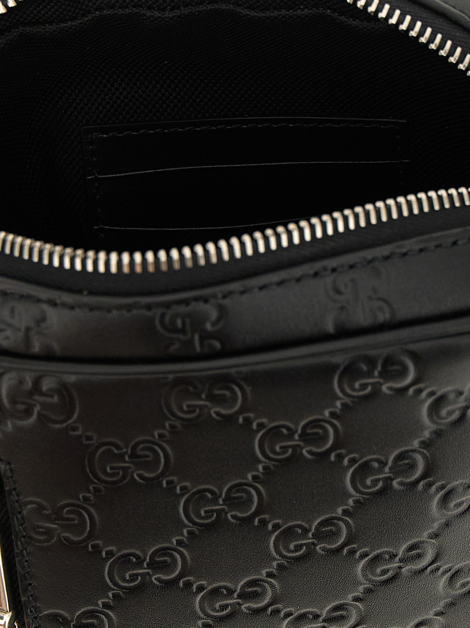 Indulge in the allure of the Gucci Black Calfskin Crossbody Bag, where exquisite craftsmanship meets timeless elegance, perfect for the discerning connoisseur.