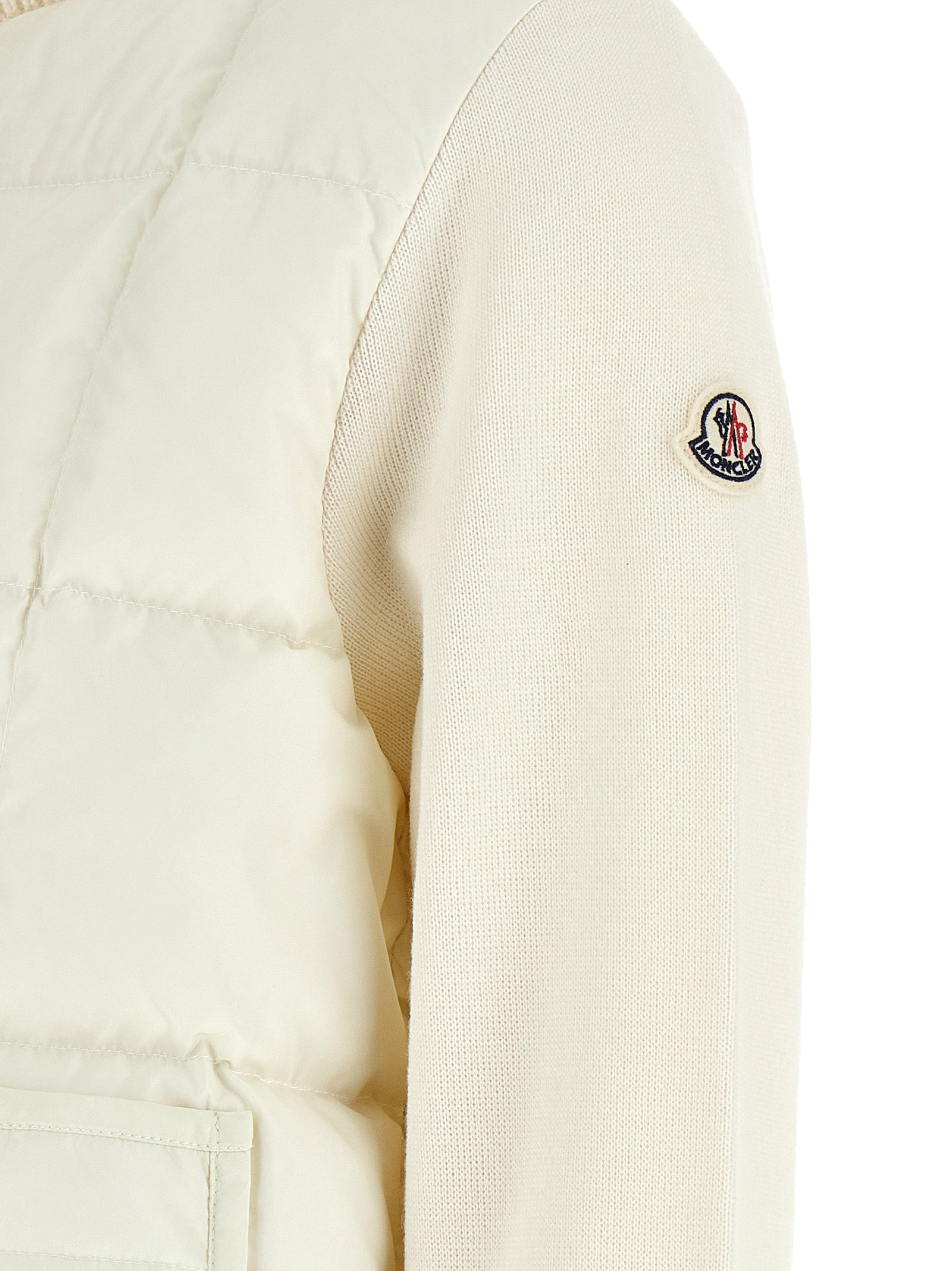 Elevate your wardrobe with the Moncler White Virgin Wool Full-Length Jacket, a sophisticated blend of elegance and innovation, perfect for timeless style transitions.