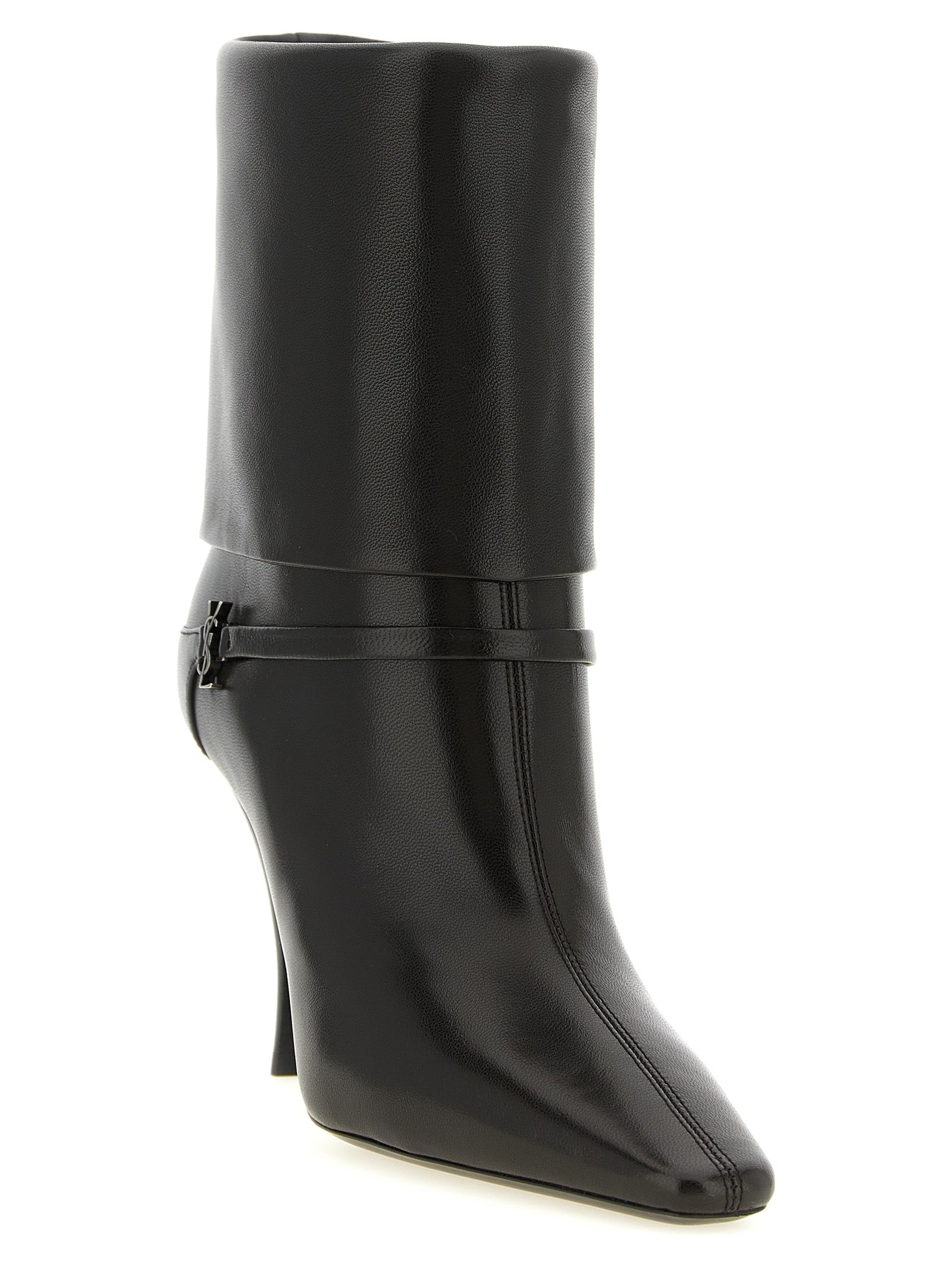 Step into audacious elegance with Saint Laurent's Niki ankle boots, crafted from sumptuous lamb leather, embodying timeless luxury and impeccable craftsmanship.