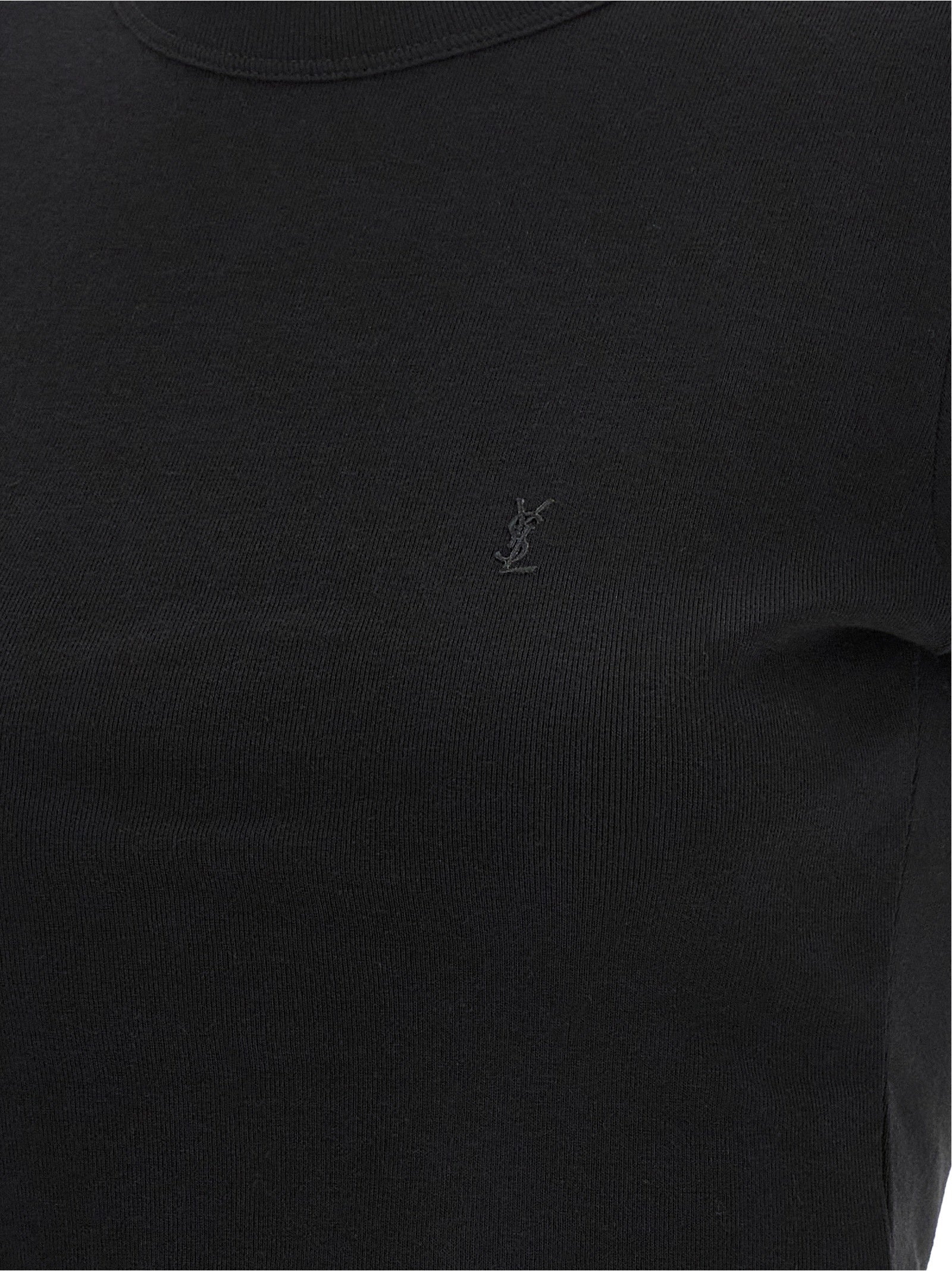 Discover the Saint Laurent Black Cotton T-Shirt, a blend of minimalist luxury and refined craftsmanship, perfect for those who embody elegance and sophistication.