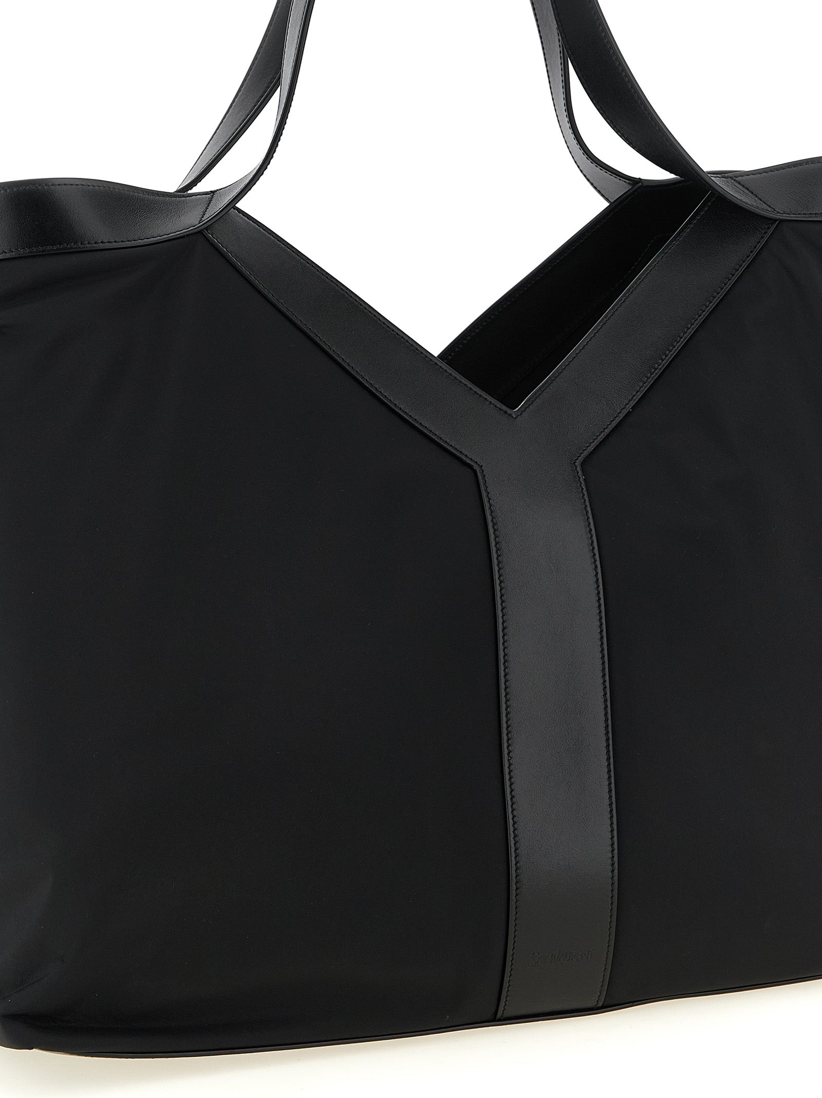 Discover the Saint Laurent Black Calfskin Tote Bag, a fusion of bold design and sustainable luxury, perfect for the discerning individual who values style and sophistication.