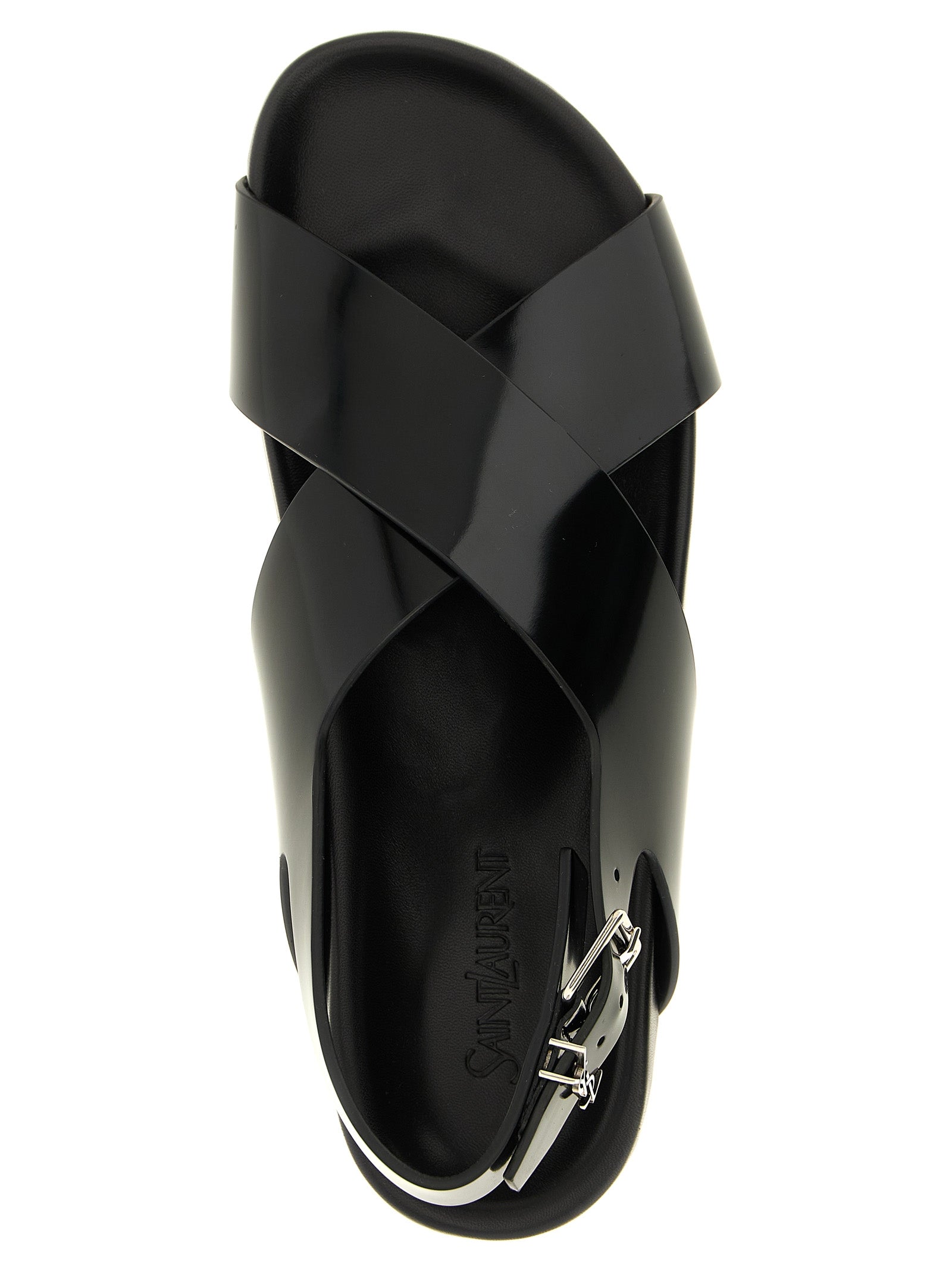 Indulge in the elegance of Saint Laurent's Helios Black Calfskin Flat Sandals, where luxurious craftsmanship meets modern sophistication, perfect for the discerning trendsetter.