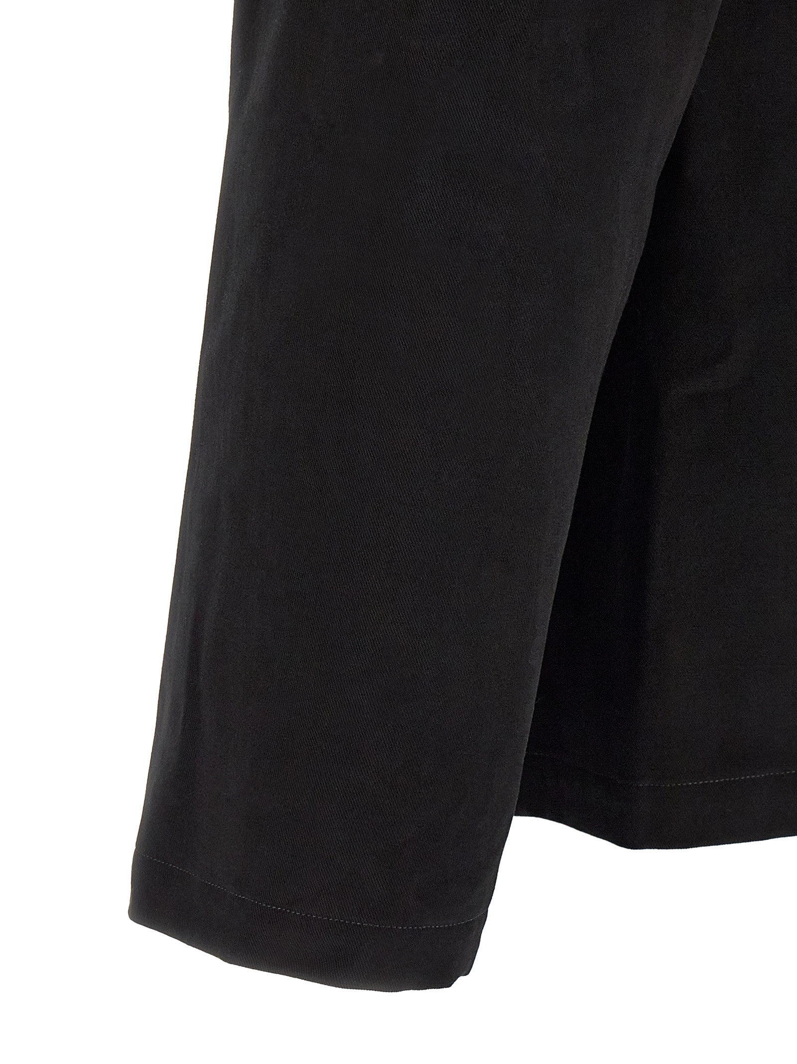 Elevate your wardrobe with the Saint Laurent Black Cotton Blouse, a masterpiece of refined craftsmanship and timeless elegance, perfect for the discerning individual.