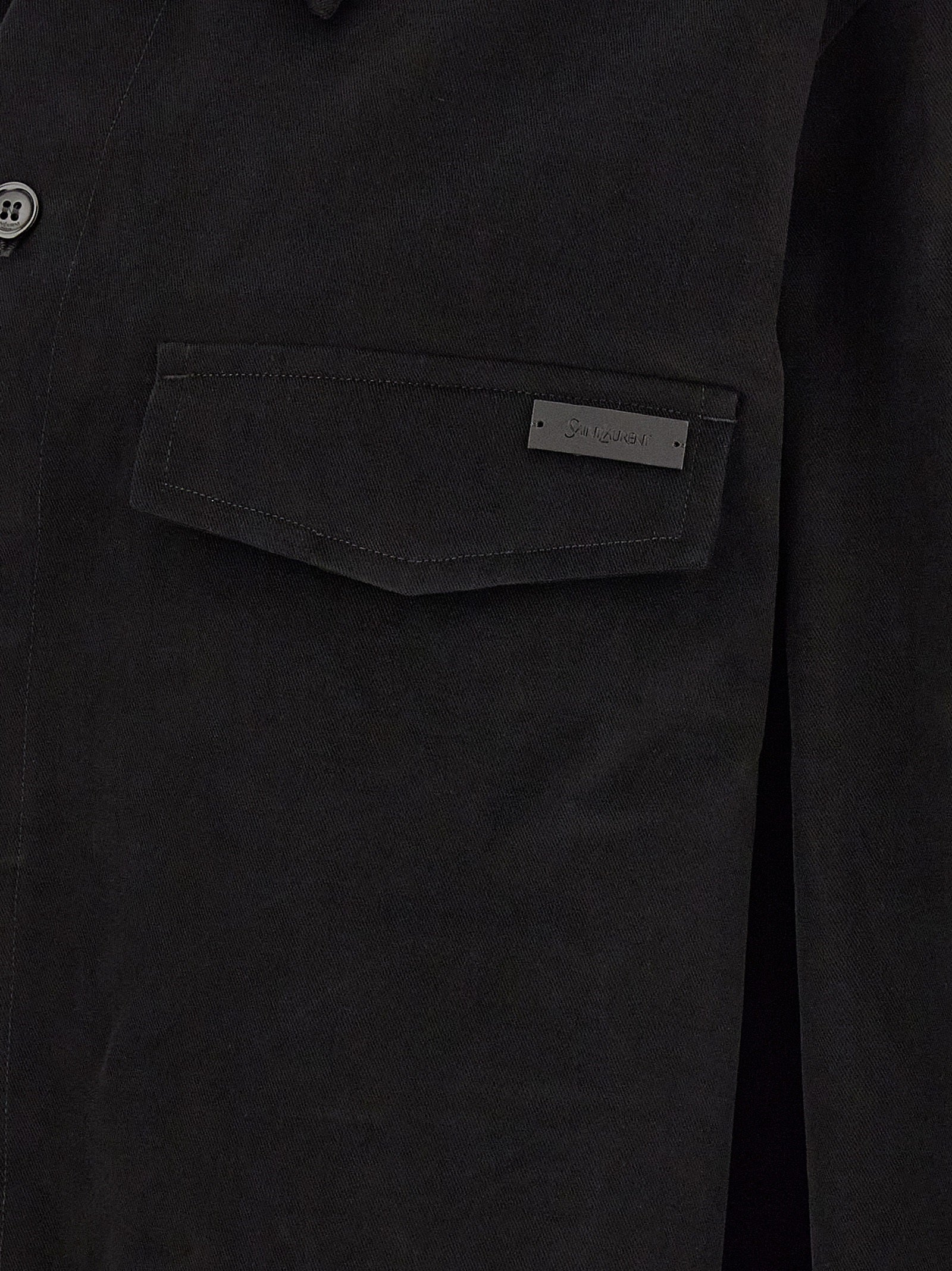 Discover the exquisite Saint Laurent Black Cotton Blouse, a blend of structured elegance and relaxed sophistication, perfect for those who appreciate timeless luxury.
