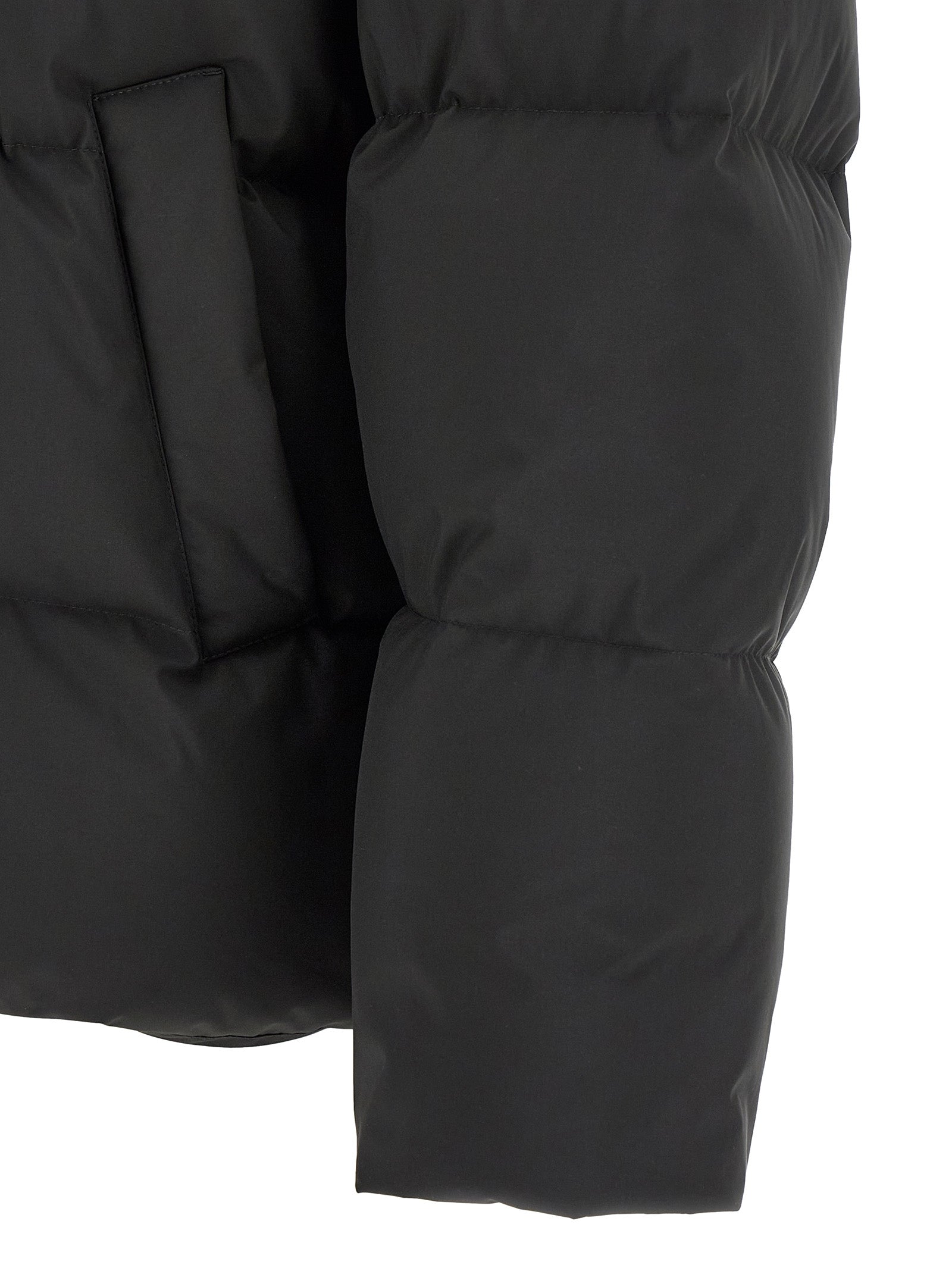 Experience the pinnacle of winter elegance with the Saint Laurent Black Polyester Full-Length Jacket, a masterful blend of architectural design and luxurious comfort.
